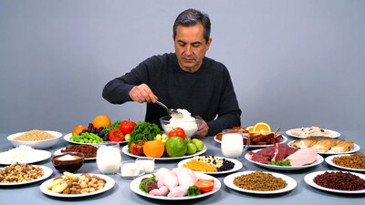 Man eating yogurt at food table