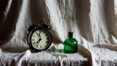 Vintage Alarm Clock and Green Bottle