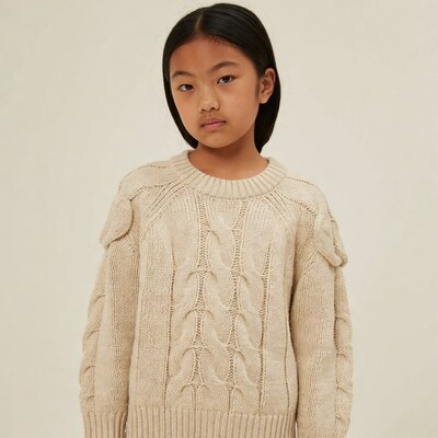 Asian girl in cable knit sweater