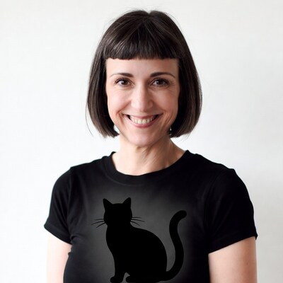 Woman smiling in black cat t-shirt
