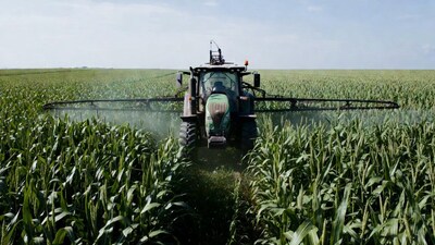 Tractor Spraying Corn Field