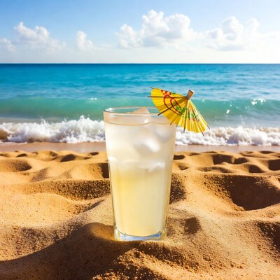 Lemonade with umbrella on beach