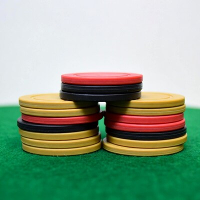 Stacked Poker Chips on Green Felt