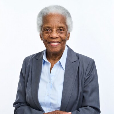 Elderly African-American woman in suit smiling