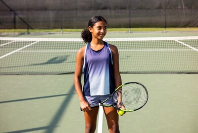 Black girl with tennis racket and ball