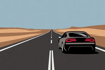 Black car driving desert highway