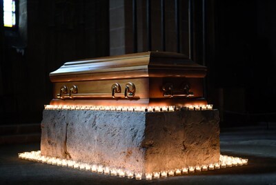 Wooden Coffin Surrounded by Candles
