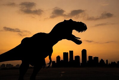T-Rex Silhouette at Sunset Cityscape