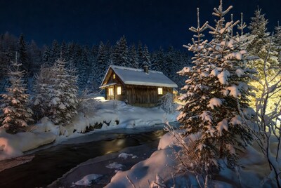 Snowy Wooden Cabin in Forest at Night