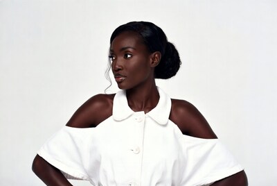 African woman in white off-shoulder top
