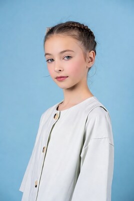 Girl with braids in white jacket