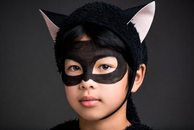 Asian girl in black cat costume
