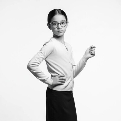 Asian girl in glasses posing confidently