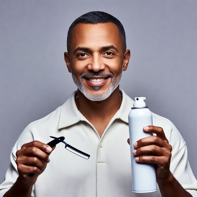 Smiling man holding razor and shaving cream
