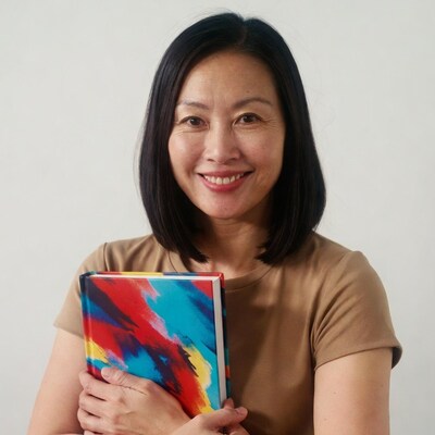 Asian woman holding colorful book