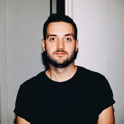 Man with beard in black t-shirt