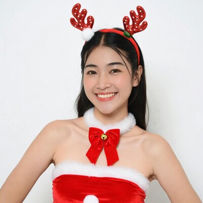 Asian woman in reindeer Santa costume