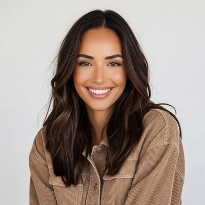 Smiling woman in corduroy jacket