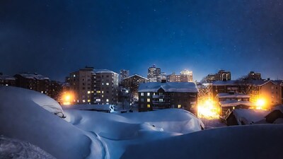 Snowy City Buildings at Night