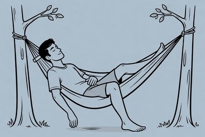 Man relaxing in hammock between trees
