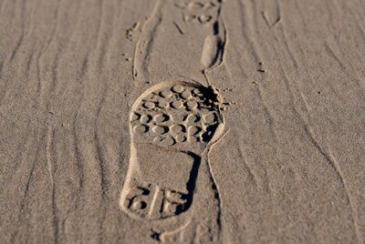 Sneaker footprint in sand