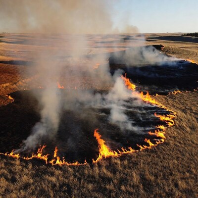 Grassland fire burning in dry fields