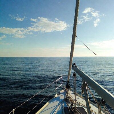 Sailboat mast over ocean
