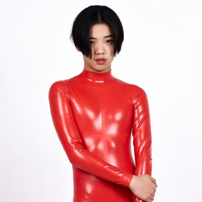Asian woman in red latex bodysuit