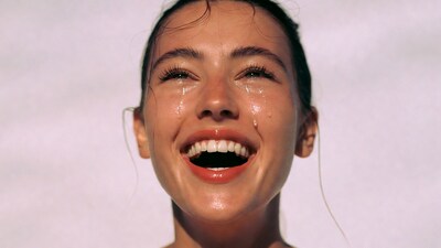 Woman laughing with tears of joy