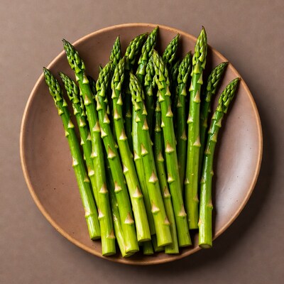 Fresh asparagus spears on plate