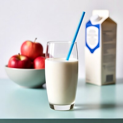 Glass of Milk with Straw and Apples
