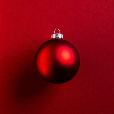 Red Christmas ornament on red background
