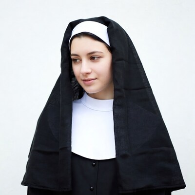Young nun in black habit