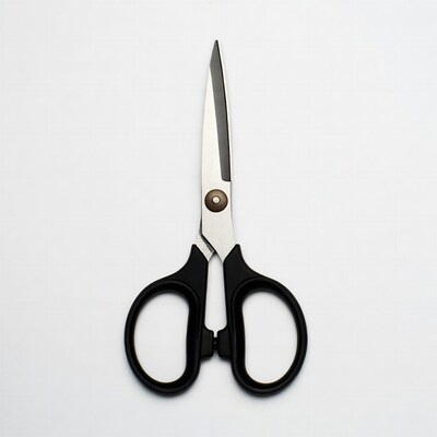 Black handled scissors on white background