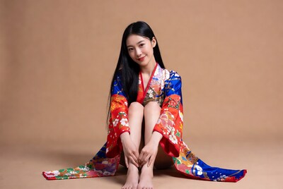 Asian woman in kimono sitting