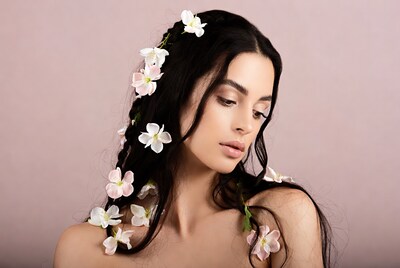 Woman with white flowers in black hair