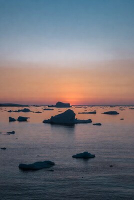 Icebergs in sunset over Arctic sea