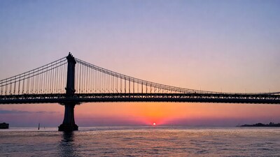 Suspension Bridge at Sunset over Water