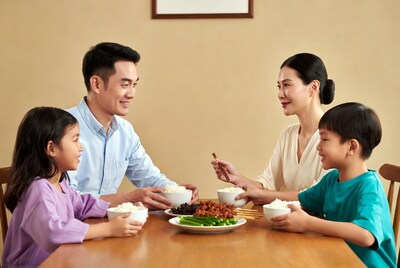 Asian family eating dinner together