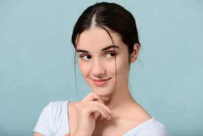 Young woman hand on chin