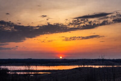 Sunset over lake and hills