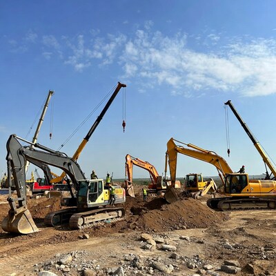 Construction excavators and cranes site