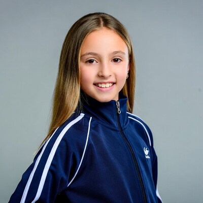 Smiling girl in navy tracksuit