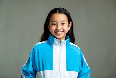Asian girl smiling in blue jacket