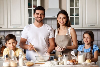 Family baking together in kitchen