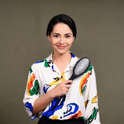 Woman holding hairbrush
