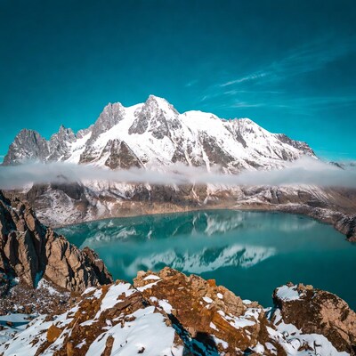 Snowy Mountains Reflecting in Turquoise Lake