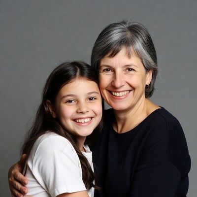 Smiling girl hugging grandmother