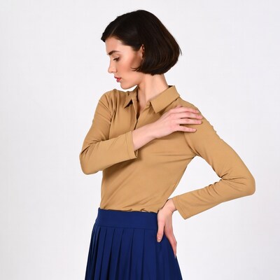 Profile of woman in beige shirt and navy skirt