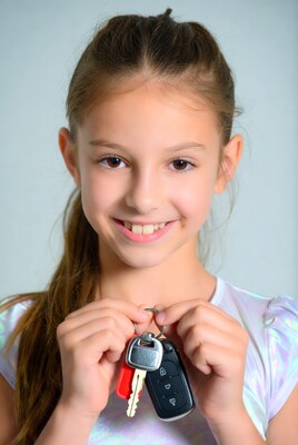 Girl holding car keys
